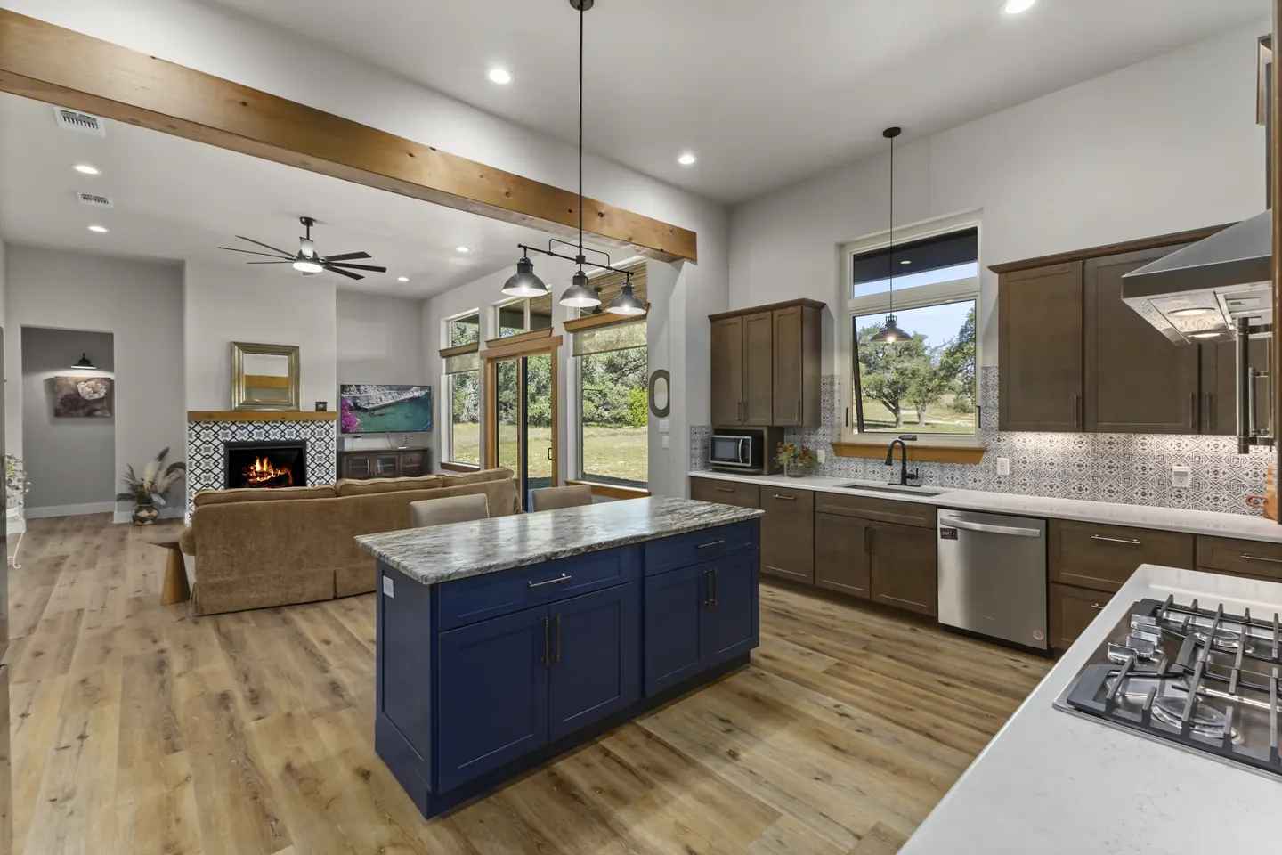 Island kitchen with quartz countertops and wood cabinetry at 924 Annabelle Avenue