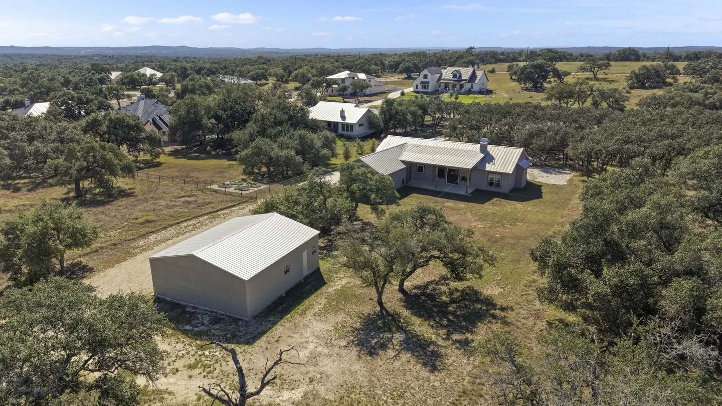 Aerial view of the residence, workshop and oak-lined acreage at 924 Annabelle Avenue