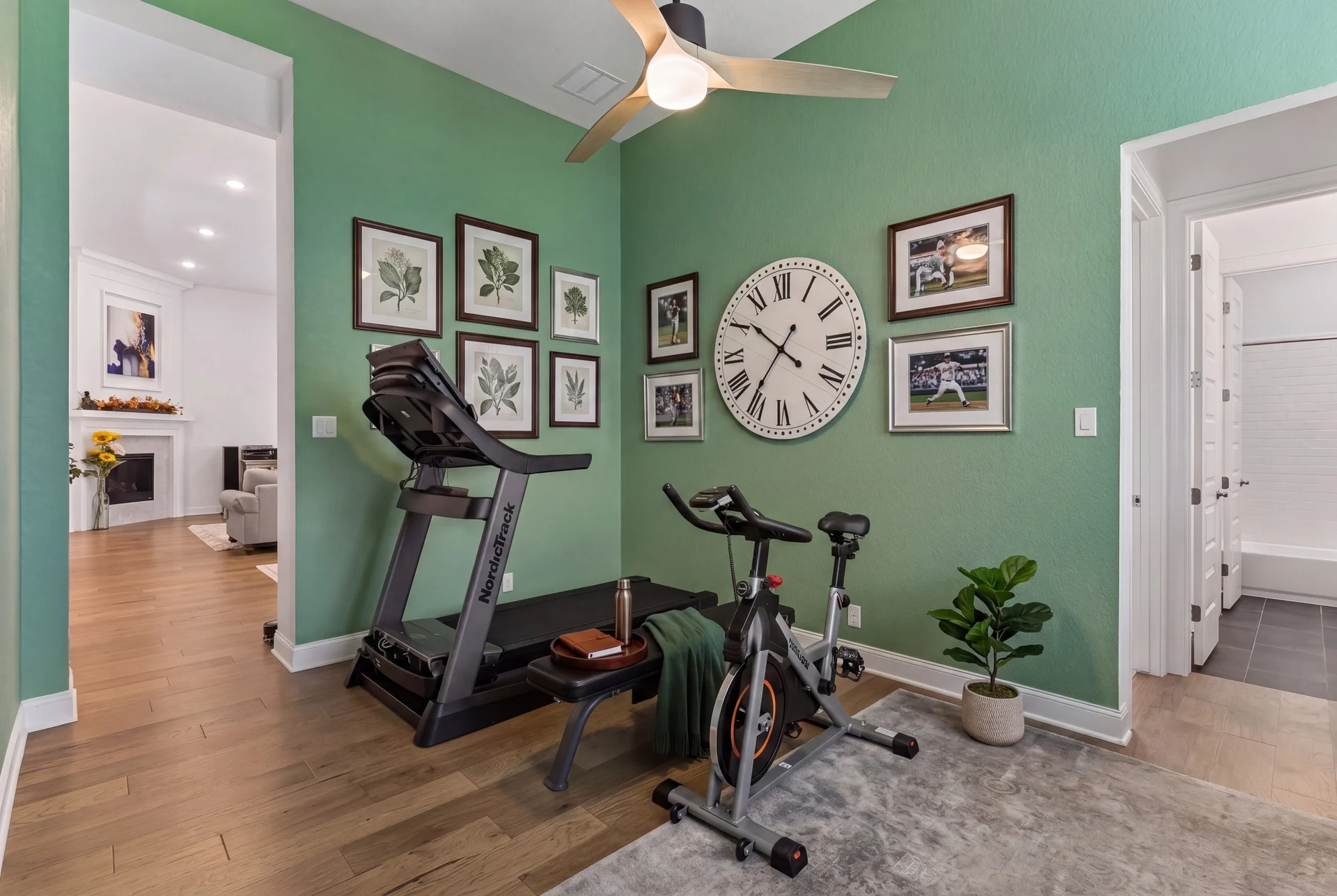 Room furnished for exercise with green walls